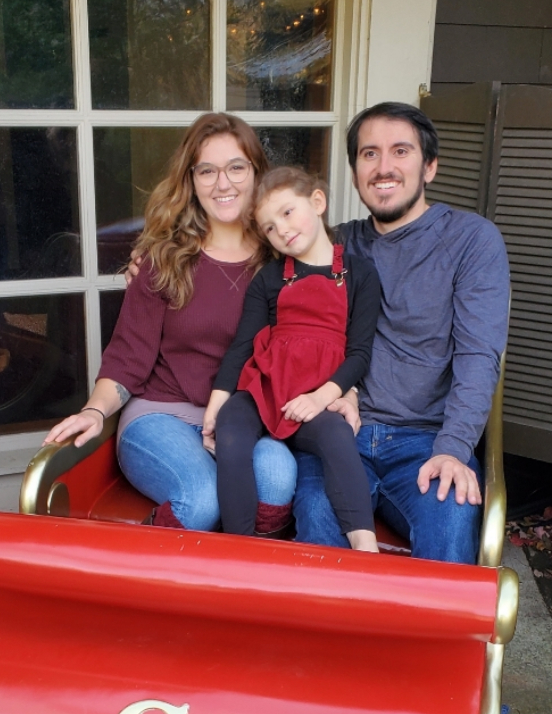 Kyden, JJ, and Elisa on a sleigh